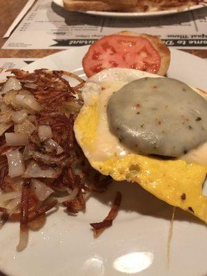 Dady Oh's  Hard roll, fried egg, sausage patty, pepper Jack cheese and tomato. Hash browns with sautéed onions.