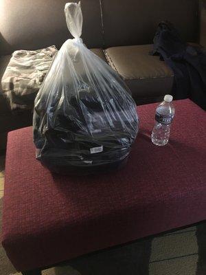 Small bag of laundry 10 pounds. Feels like 6 or 7 pounds. Bottle of water for size reference. She wanted to charge me $50!