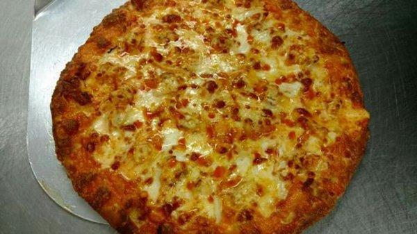 Buffalo Chicken Pizza on a Hand Tossed Crust. Dough made from scratch on-site.