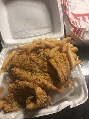 Ok so I opened my lid and there is about 4 large pieces of catfish fillets and fries.  Crunchy and freshly cooked not to much lemon pepper.