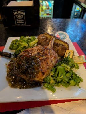 Loin pork chop with jalapeno jelly, baked potato and broccoli.