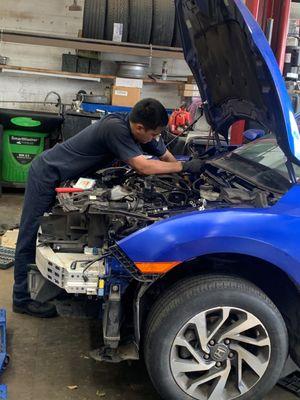 Here's a photo of us working on a vehicle!