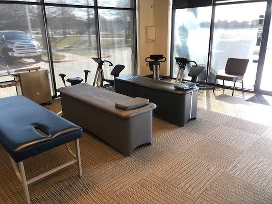 Intersegmental traction tables, Precor trainers, and wobble chairs aid in rehab.