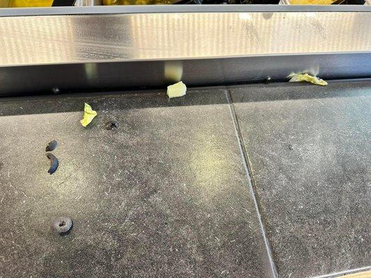 Food droppings on the salad bar line