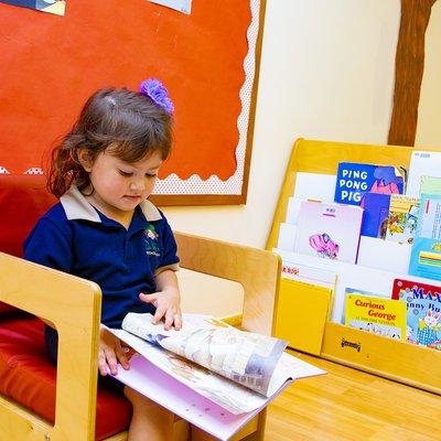 Working within learning centers! Each classroom has different identified spaces, which allow kids to work, explore and play independently