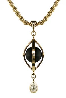 14k Yellow gold cage pendant with a black pearl and diamonds