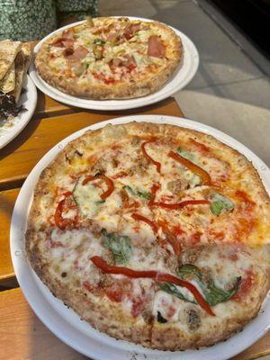 Toscano Pizza in the front $12.65 and Siciliana Pizza in the back $14.90