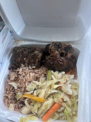 Oxtails includes rice & cabbage