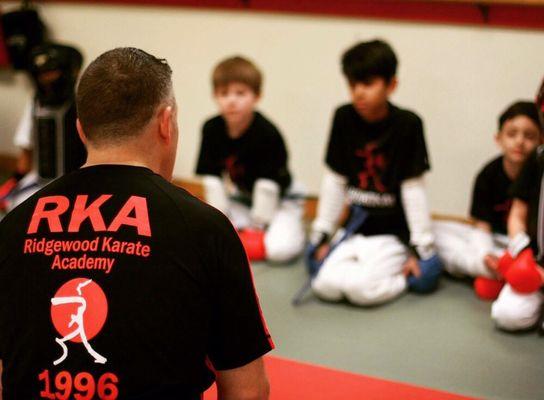 Master Smyer telling the kids the importance of sparring and how you don't use it off the mat unless you are defending yourself.