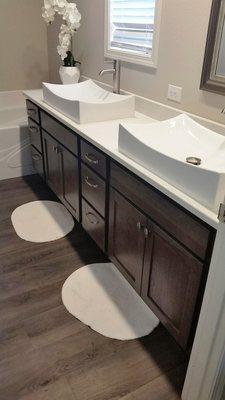 Rich brown hickory stained cabinets in this chic & stylish bathroom vanity in Ridgefield, Washington.