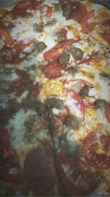 12inch, thin crust with tomatoes, pepperoni, ground beef, sausage, and extra cheese. Very tasty.