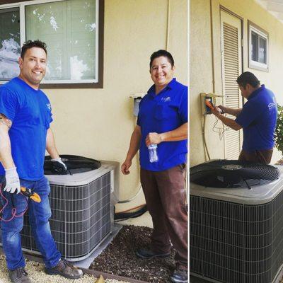 Dave and Rene pulling wire for an air conditioning unit. 90 degrees this October day. Need AC to work!