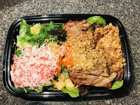 poke bowl mixed greens, grilled chicken, pineapples, cucumbers, green onion, fried garlic, fried onions, seaweed and crab meat (imitation)