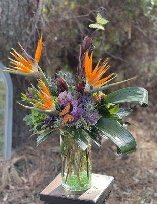 Beautiful Birds Of Paradise artfully designed with more temprant blooms. Call to place an order 757-548-4800