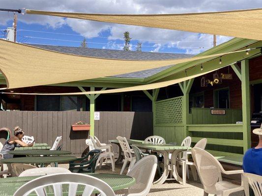 Outdoor seating in the patio. There are small seating tables in the covered deck as well.