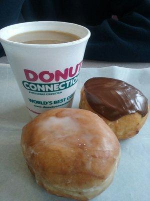 Cinnamon  Swirlie ( foreground ), Boston  Cream, small coffee.