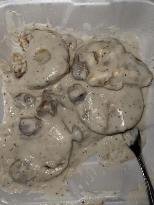 That is supposedly sausage gravy and biscuits. Ew. Tastes even worse than it looks.