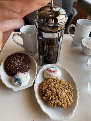 Homemade cookies with whipped cream and French press coffee