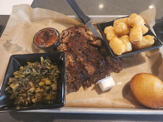 Brisket dinner with collards and tots as the sides (many other options available, like mac n cheese, chili etc.)