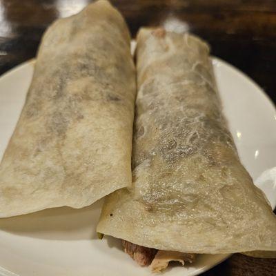 Peking duck in rolled rice paper pancake