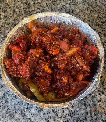 Chilli Chicken....Fried chicken sautéed with onion, tomato and peppers then glazed.  Bomb fusion dish! My son Loved everything :)