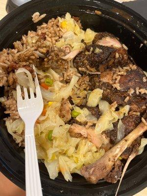 Large Jerk Chicken with steamed cabbage and rice and peas