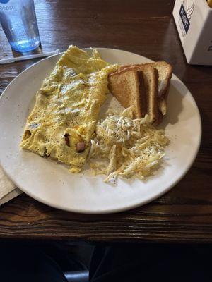 Western omelette with hashbrowns and white toast.