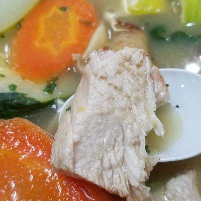 Chicken in soup close up