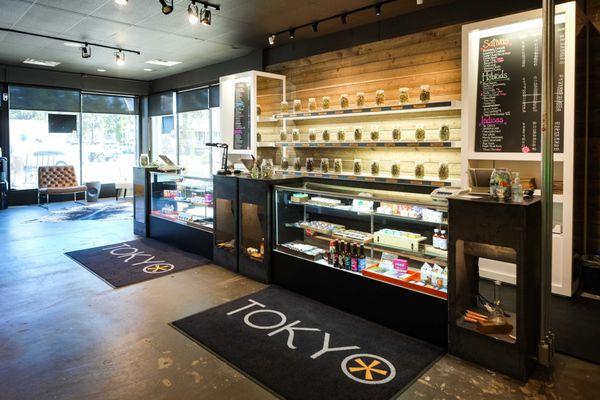 Counter, flower shelf, seating area in TOKYO STARFISH Dispensary SE 3rd St, Bend, OR 97702 location.