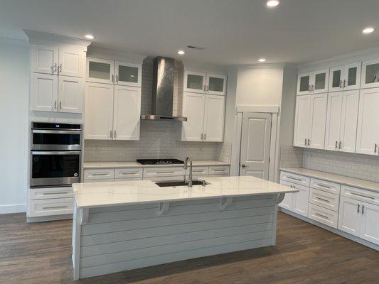 Full kitchen installation ( cabinets, appliances, countertops and flooring)