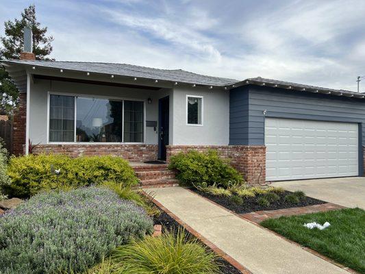 This is the finished product (new gutters go in soon), but even the back of the house, everything has been painted meticulously!