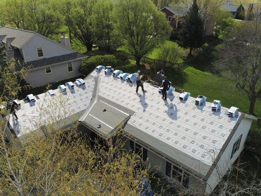 Roof replacement in Waukesha.  Tear off done, underlayment installed, and shingles loaded.