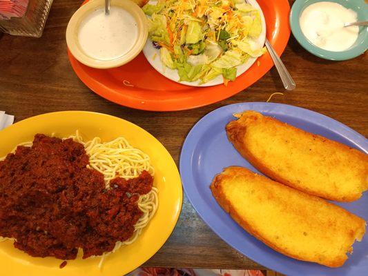 Spaghetti with meat sauce a dinner salad and garlic bread