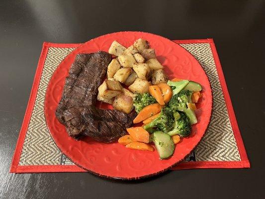 Skirt steak with roasted potatoes and veggies.