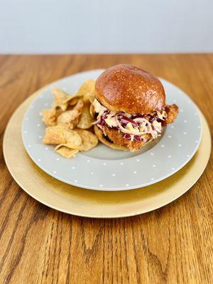 Katsu Nao: Sesame brined-panko crusted chicken breast, gochujang cabbage slaw, katsu sauce on a house challah bun & furikake chips