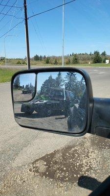 The wrong tow truck, in my mirror.