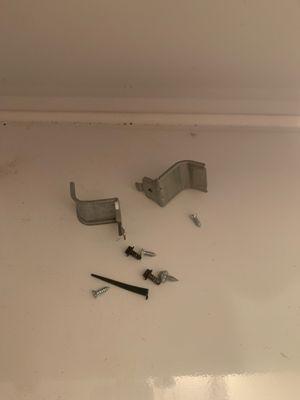 Parts that were not put back when the dryer was reassembled.