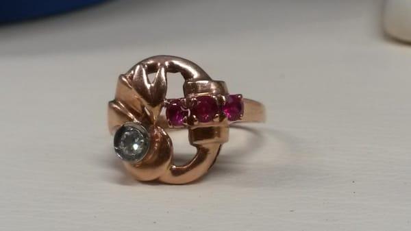 This elegant hand made custom designed ruby and diamond rose gold ring is a one of a kind...