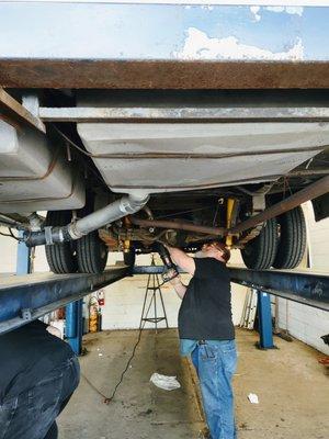 Getting new Muffler system
 The original was filled with Holes and rusted through hung up by haybale wires .