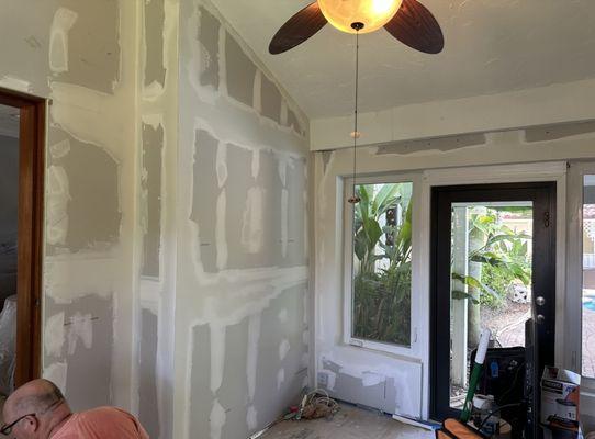 Applying new drywall to an entire room to modernize the clients media room.