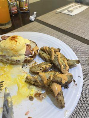 1/2 of the eggs Benedict it was so good he dug in