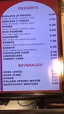 Menu inside restaurant. Poland Spring Water is priced at $1.25.