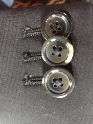 Broken but brand new buttons from fairmount cleaners