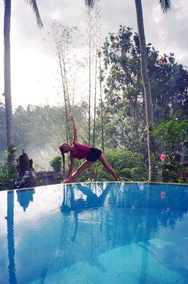 Triangle Pose in magical Bali by the pool