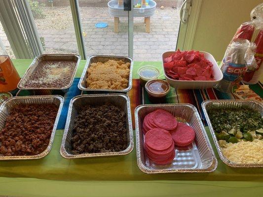 Rice, beans , carne asada , pastor , salsa, toppings , tortillas and chips