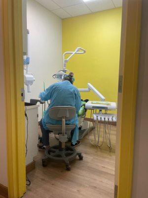 Child getting teeth cleaned at dentist