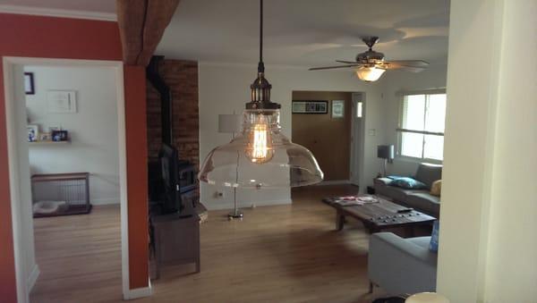 Single, larger pendant light over the kitchen bar.