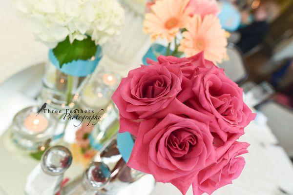 Our beautiful wedding center pieces. Photos by Three Feathers Photography.