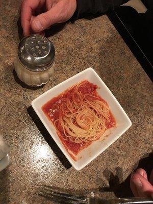 This was the side of pasta we got with the chicken Parmesan.  Compare this to the cheese shaker.