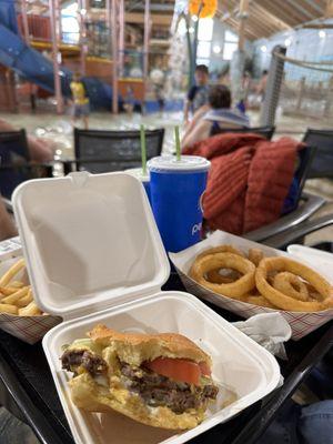 Burgers and onion rings from Buckets burger place right next to the pools and the bar.